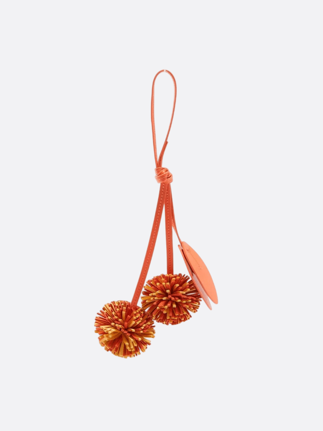 Bijou de sac pompon cuir orange